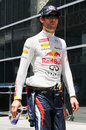 Mark Webber walks through the paddock after being eliminated in Q1