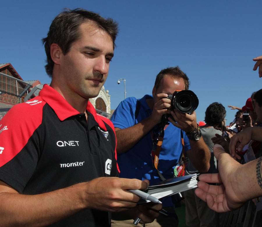 Timo Glock signs autographs