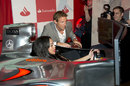 Jenson Button teaches Radio 1Xtra DJ Sarah Jane Crawford how to drive at the London Grand Prix VIP Event