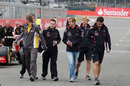 Sebastian Vettel walks the track with his team of engineers