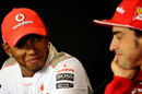 Lewis Hamilton smiles at a question during the driver press conference