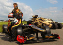 Lotus drivers Romain Grosjean and Kimi Raikkonen pose for a photoshoot promoting the new Batman film