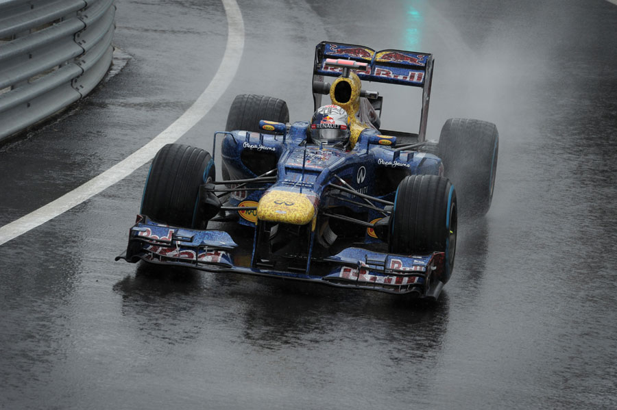 Sebastian Vettel exits the pit lane on full wet tyres