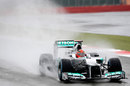 Michael Schumacher heads through the rain