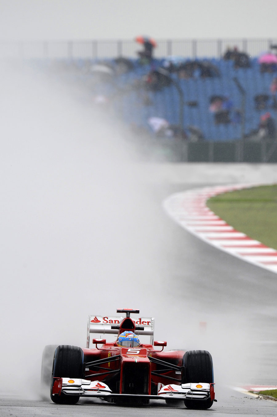 Fernando Alonso takes to the pit lane