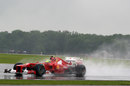 Felipe Massa kicks up a trail of spray