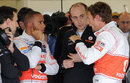 Jenson Button and Lewis Hamilton in discussion in the McLaren garage