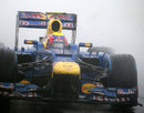 Mark Webber on track in the worst of the conditions during qualifying