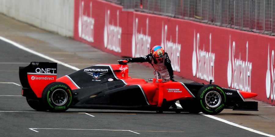 Timo Glock pushes his Marussia after a spin in qualifying