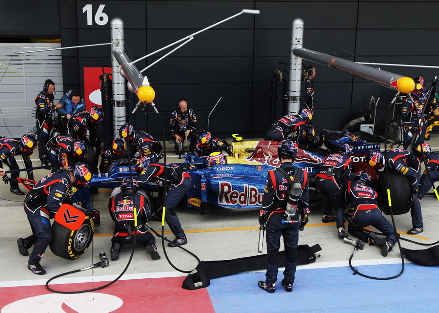 Mark Webber makes a pit stop on his way to victory