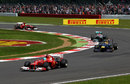 Fernando Alonso leads Mark Webber and Michael Schumacher early in the race