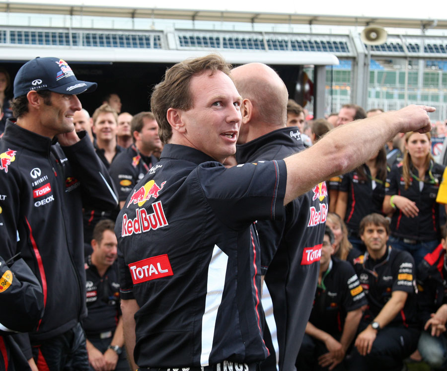 Christian Horner directs team members ahead of Mark Webber's celebration photo