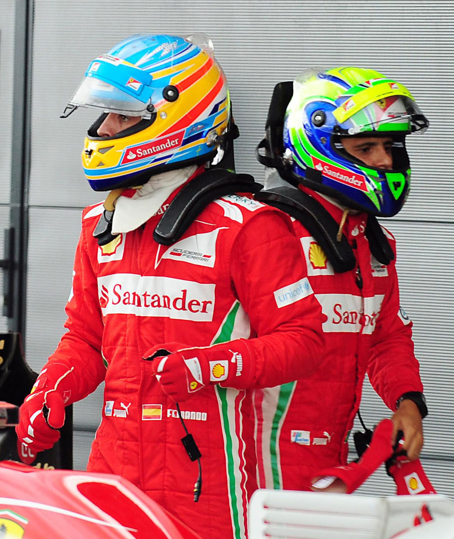 Fernando Alonso and Felipe Massa in parc ferme after Alonso secured pole position