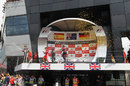 Mark Webber, Fernando Alonso and Sebastian Vettel celebrate on the podium