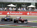 Fernando Alonso leads Mark Webber early in the race