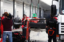 The Marussia is recovered to the pits