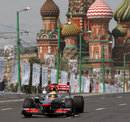 Lewis Hamilton drives a McLaren MP4-26 through Moscow on a demonstration run