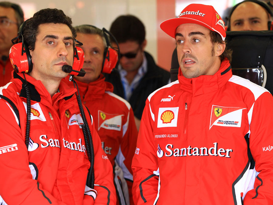 Fernando Alonso and Andrea Stella in the Ferrari garage
