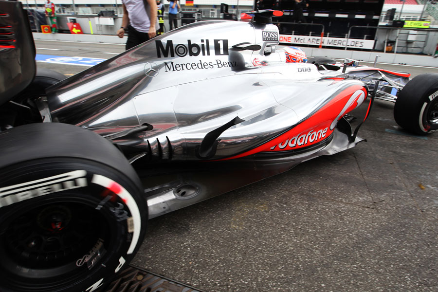 Jenson Button leaves the pits in the McLaren