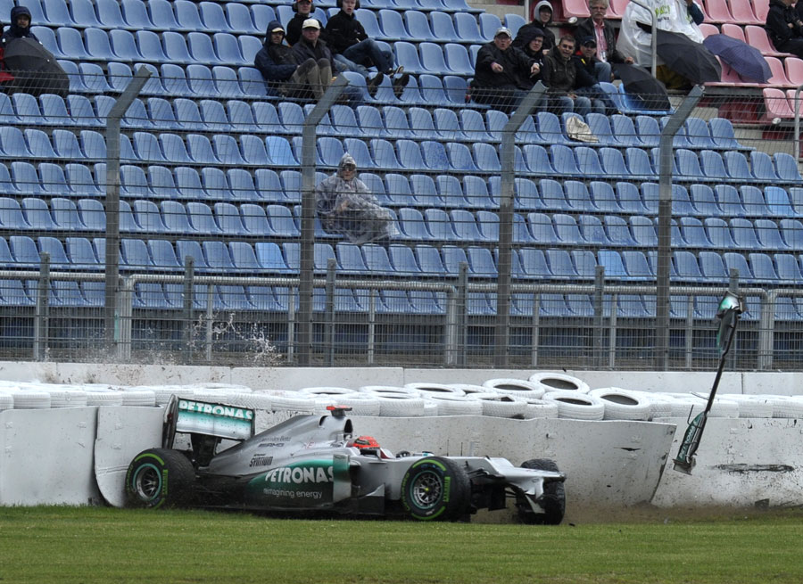 Michael Schumacher crashes in the wet at the end of FP2