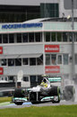 Nico Rosberg kicks up spray on the intermediate tyres