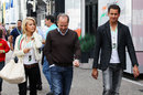 Adrian Sutil arrives at the circuit on Saturday with his manager Manfred Zimmerman