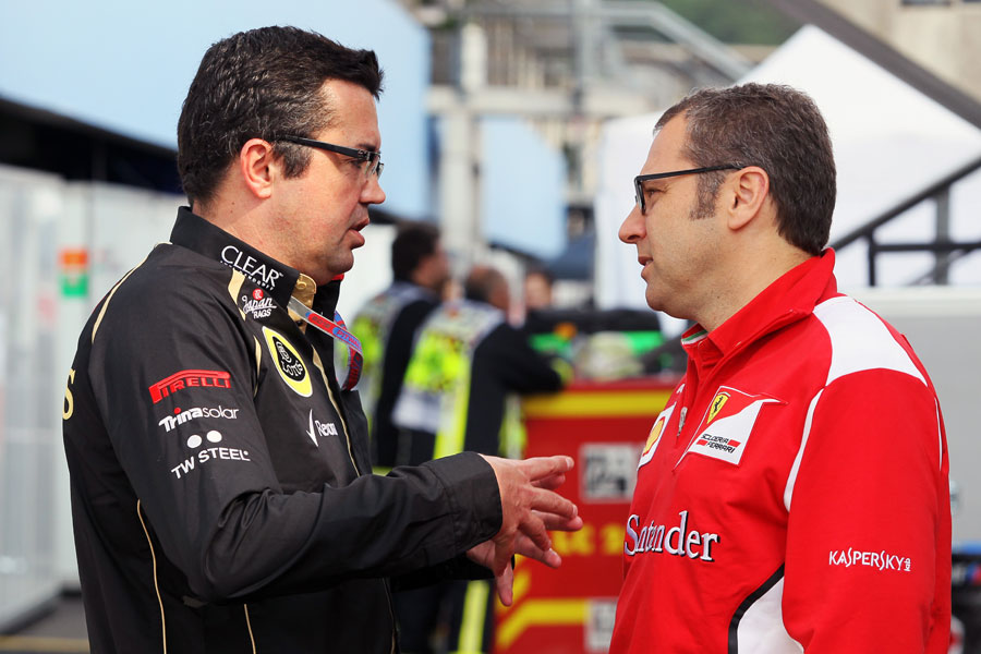 Eric Boullier and Stefano Domenicali deep in discussion in the paddock
