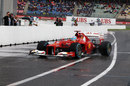 Fernando Alonso returns to parc ferme after taking pole