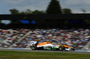 Nico Hulkenberg flashes past the grandstands on a soft tyre stint