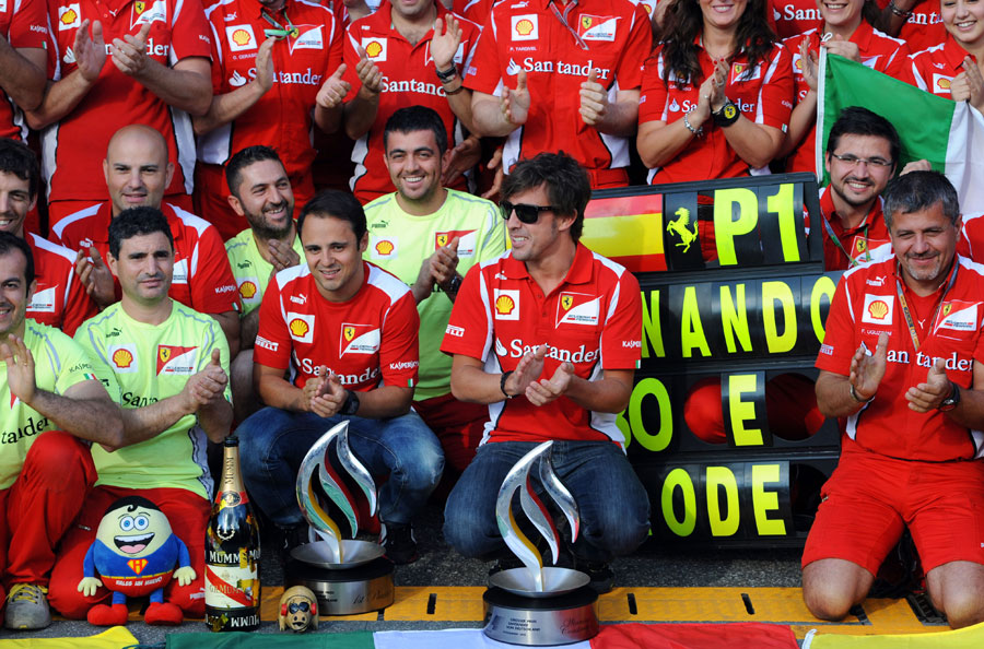 Fernando Alonso and Felipe Massa celebrate after the race