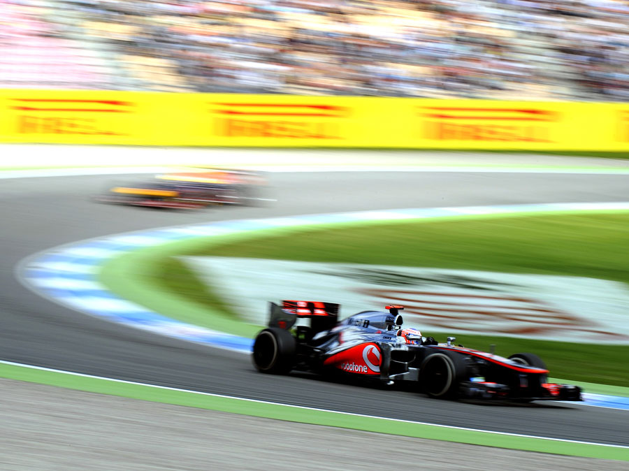 Jenson Button leads Sebastian Vettel on track