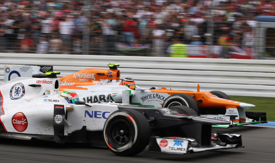 Sergio Perez goes wheel-to-wheel with Nico Hulkenberg