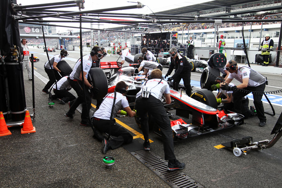 Jenson Button comes in for a practice pit stop