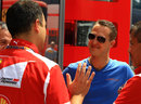 Michael Schumacher catches up with some Ferrari employees