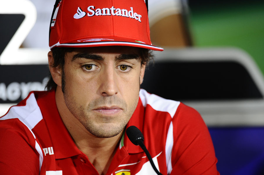 Fernando Alonso deep in thought in the driver press conference