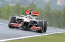 Jenson Button gets caught in the rain on slick tyres