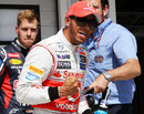 Lewis Hamilton celebrates taking pole position 