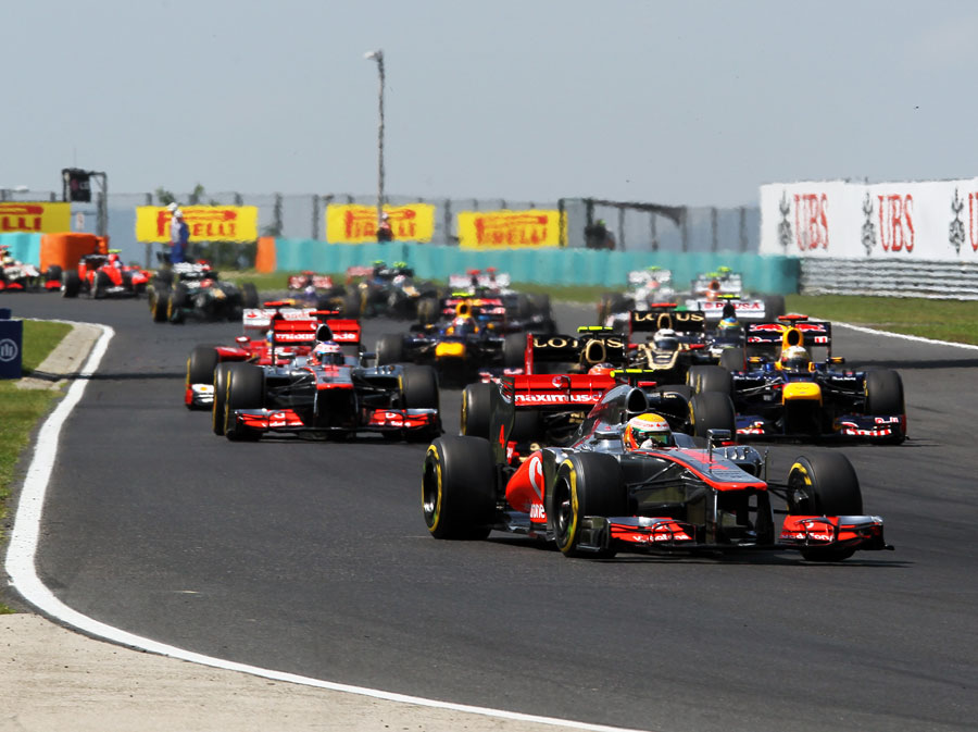 Lewis Hamilton leads the field into turn two on the first lap