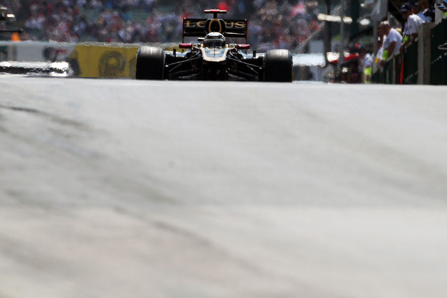 Kimi Raikkonen rolls down the pit lane