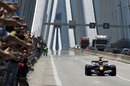 Mark Webber drives his Red Bull across the Rio Antirio bridge