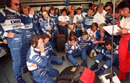 The Arrows team watches on nervously as Damon Hill's car starts to fail him during the closing laps