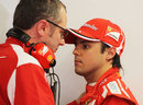 Felipe Massa and Stefano Domenicali in conversation in the Ferrari garage