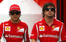 Felipe Massa and Fernando Alonso walk through the paddock