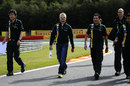 Heikki Kovalainen walks the track with his Caterham team