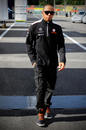 Lewis Hamilton walks through the paddock on Thursday