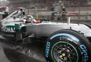 Michael Schumacher leaves the pits on wet tyres