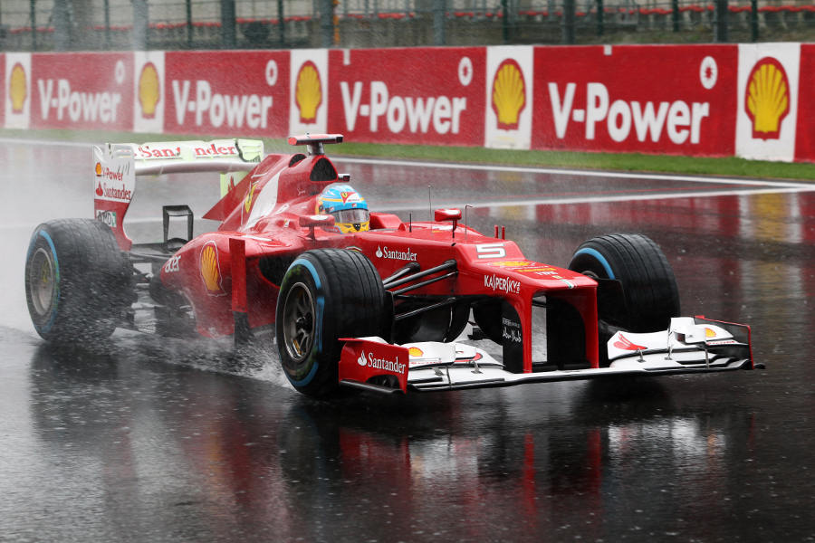 Fernando Alonso pulls away after a practice start on the grid
