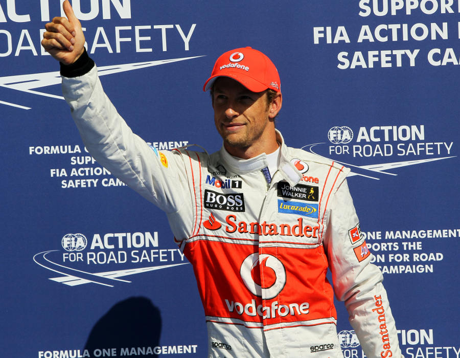 Jenson Button celebrates his pole position
