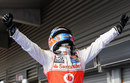 Jenson Button celebrates victory in parc ferme