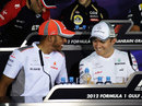 Nico Rosberg and Lewis Hamilton share a joke during the driver press conference